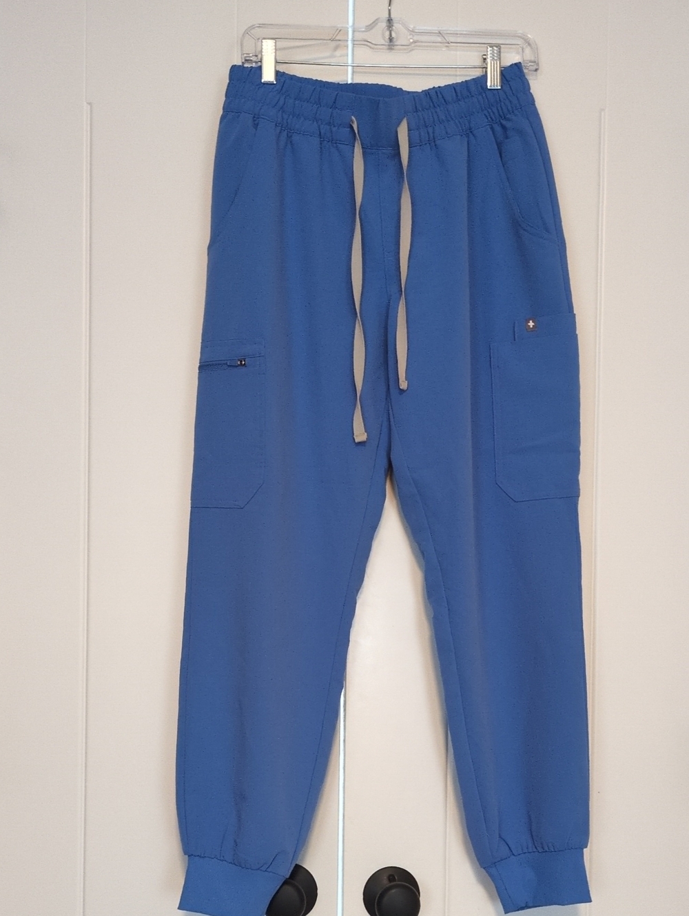 FIGS Technical Collection jogger scrub pants in Ciel blue, size Medium.